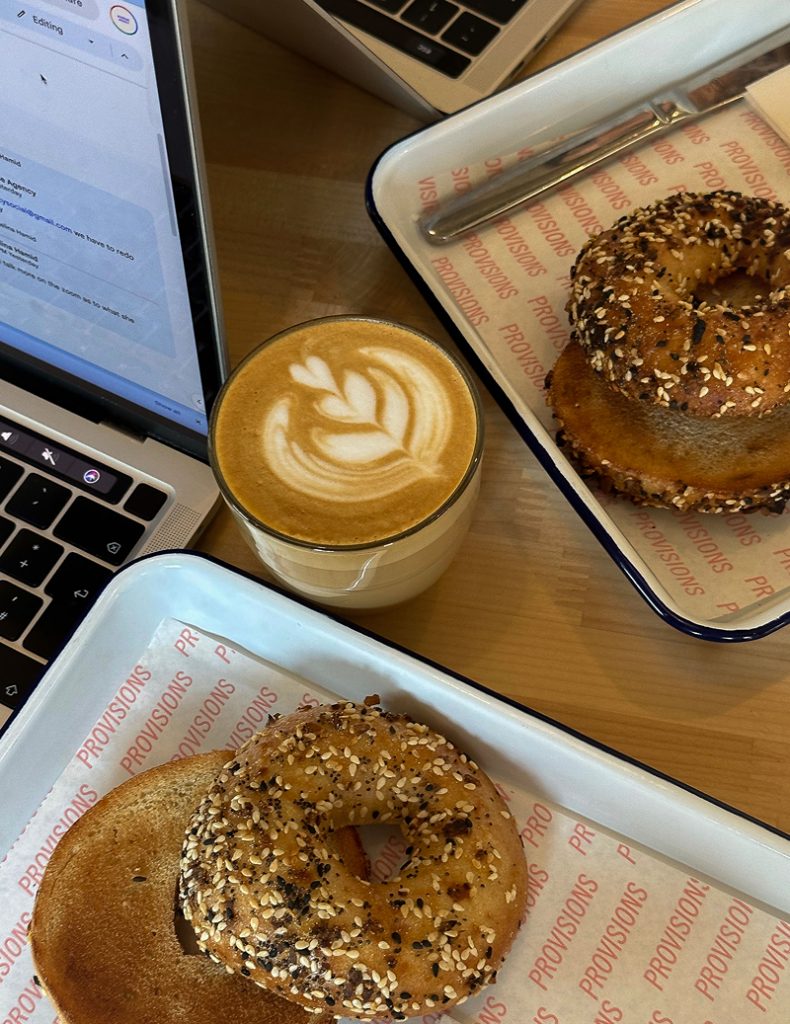 designing a showit website in a coffee shop with bagels